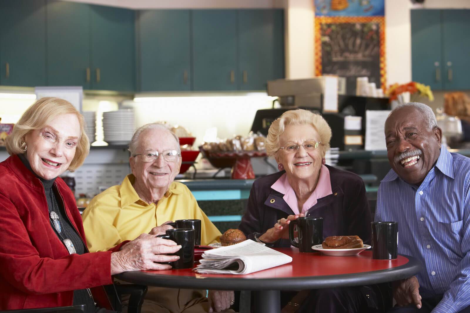 Okanagan seniors sitting around a table in a care home facility